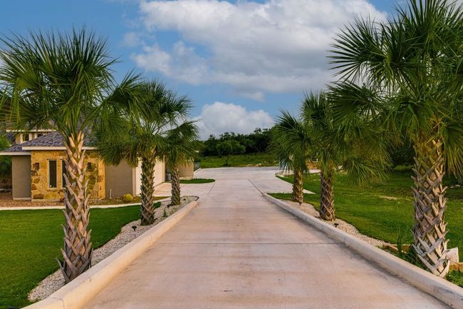 Custom driveway leading to property and RV storage unit | Image 7