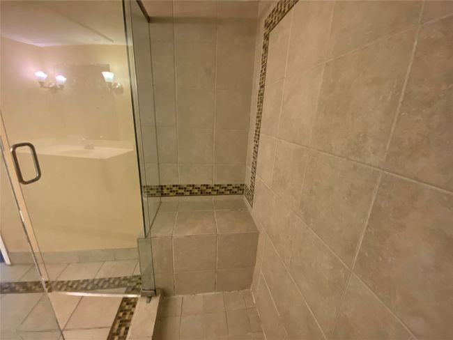 Full bath featuring tile patterned flooring and a stall shower | Image 15