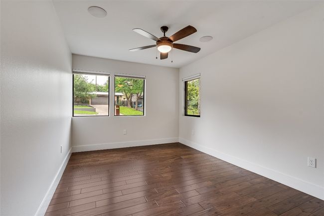 Two additional bedrooms sit in their own hallway apart from this primary suite, which is excellent for privacy. | Image 28