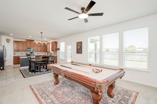 Playroom with plenty of natural light, pool table, ceiling fan, light colored carpet, and recessed lighting | Image 10