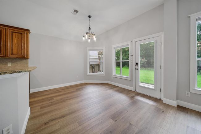 Enjoy the breakfast area filled with natural light and tranquil views of your backyard while sipping your morning coffee or enjoying a meal. | Image 14