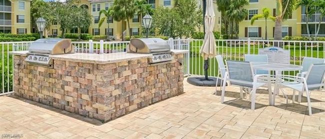 View of patio / terrace featuring area for grilling and outdoor dining space | Image 28