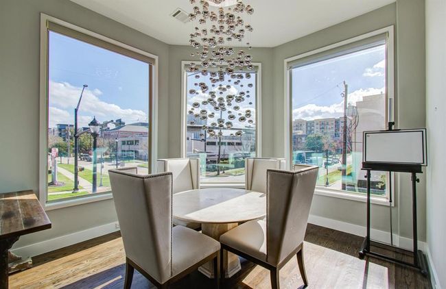 Separate breakfast area with immaculate views and modern lighting. | Image 17
