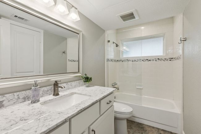 Full bathroom with vanity, toilet, and bathtub / shower combination | Image 7
