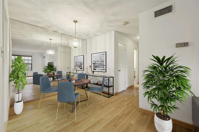 Dining area, with view down hallway to the 2 bedroom. | Image 6