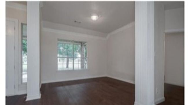 Entryway featuring dark wood-style floors and crown molding | Image 19