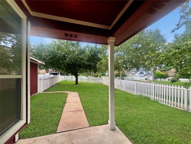 View of fenced backyard | Image 36