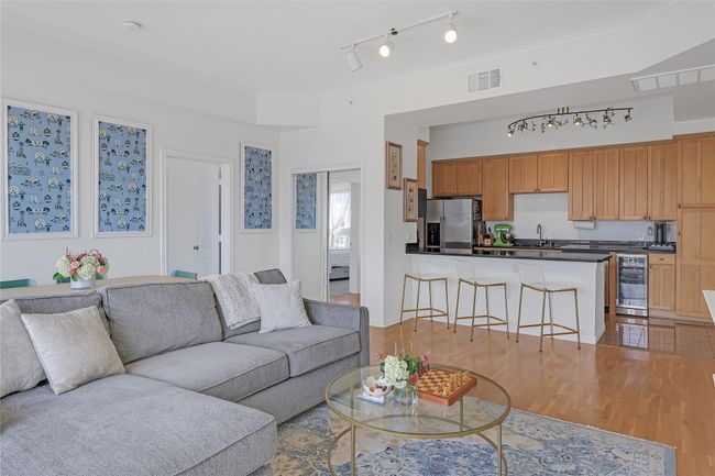 Living room featuring beverage cooler and light wood finished floors | Image 4