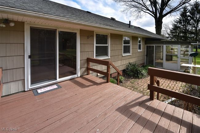 Wooden deck with a sunroom | Image 8