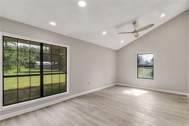 Spare room with light hardwood / wood-style flooring, ceiling fan, and plenty of natural light | Image 7