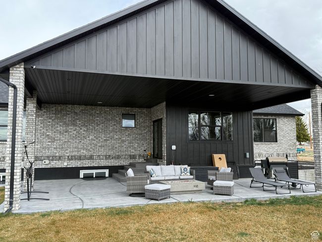 View of patio with an outdoor hangout area | Image 24
