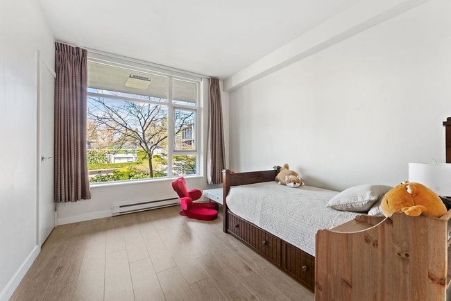 second bedroom with view of the beautiful courtyard. | Image 29