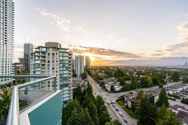 Balcony at dusk with a view of city and a mountain view | Image 22
