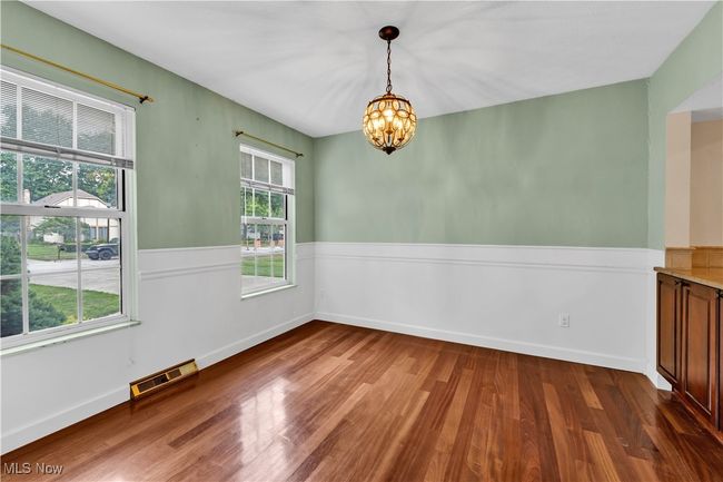 DINING ROOM FOR SPECIAL GATHERINGS OR FAMILY MEALS....CUSTOM BUILT IN CABINETS PROVIDE EXTRA STORAGE SPACE WITH CONVENIENT PASS THRU COUNTER FROM KITCHEN | Image 5