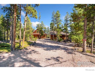 Wraparound porch around the entire home | Image 1