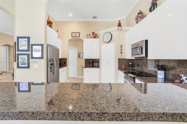 3848 Oak Ridge Cir, House other with 4 bedrooms, 3 bathrooms and null parking in Weston FL | Image 4