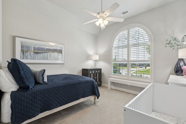 Carpeted bedroom with lofted ceiling and ceiling fan | Image 24