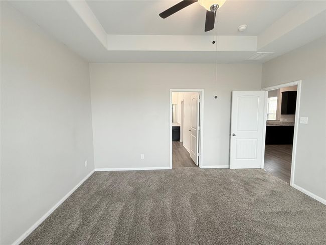 14501 SUGAR PINES DR - Primary bedroom with ensuite bathroom, dual sinks, separate tub and shower, and walk in closet | Image 27