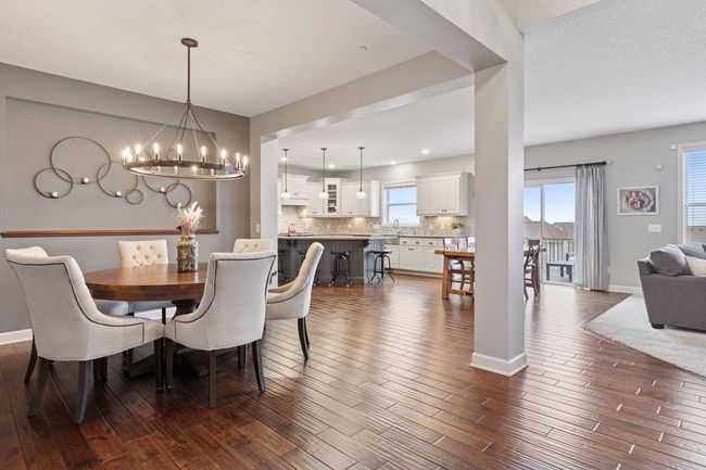 Formal dining room is open to the living room and kitchen | Image 9