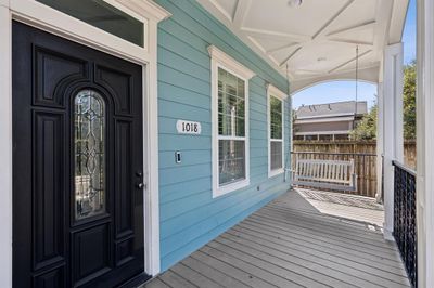 A welcoming front porch complete with swing. | Image 3