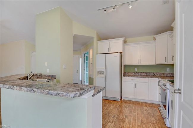 Kitchen with bar seating peninsula | Image 10