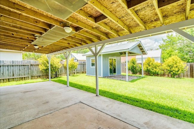 Large covered and extended back patio | Image 30