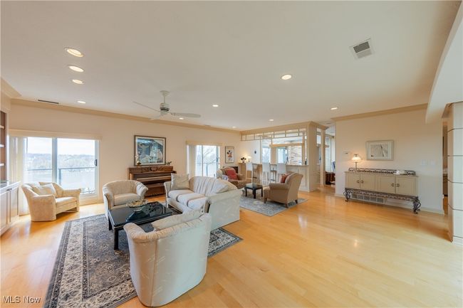 Living room featuring ceiling fan, visible vents, light wood-type flooring, and recessed lighting | Image 16