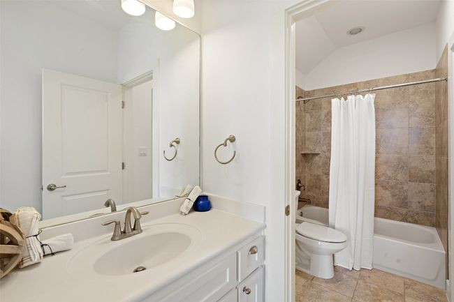 Full bath upstairs with vanity and shower / bath combination | Image 21