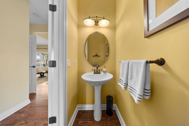 Main floor lav with hardwood | Image 34