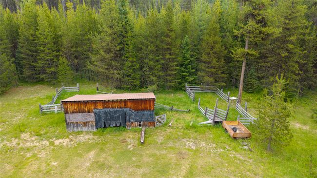 Aerial view of property and surrounding area featuring a forest | Image 4