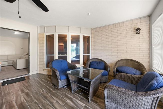 Sunroom / solarium featuring ceiling fan | Image 34