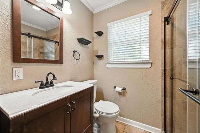 Hall with a textured wall and wood finished floors | Image 20