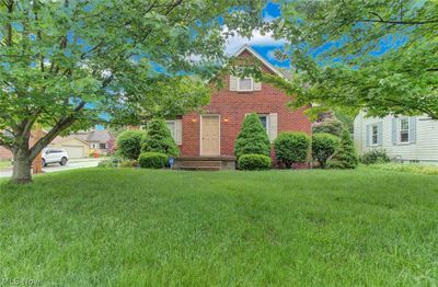 View of front of property with a garage and a front yard | Image 2