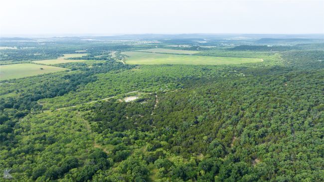 Aerial view of a heavily wooded area | Image 17