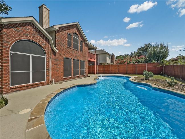 View of pool featuring a fenced backyard and a patio | Image 25