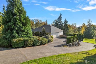 Double driveways. Each leading to separate upper and lower level garages. | Image 2