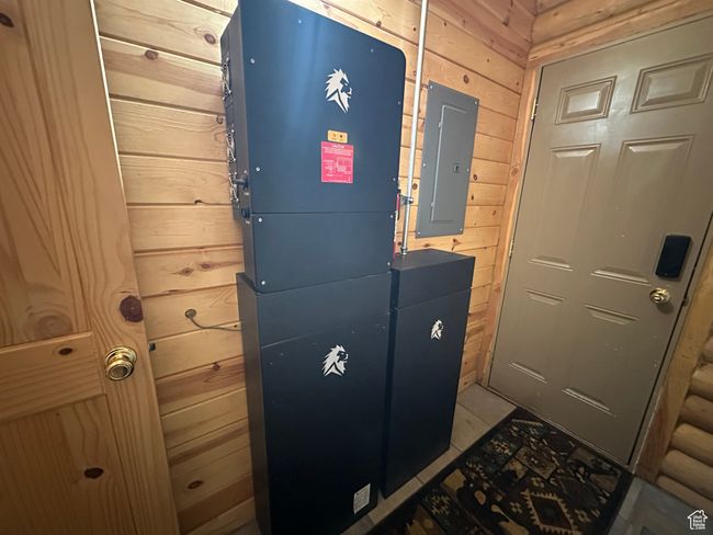 Entryway with electric panel and wooden walls | Image 20