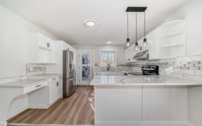 32 Dovista Crt Se, Home with 4 bedrooms, 2 bathrooms and 2 parking in Calgary AB | Image 1