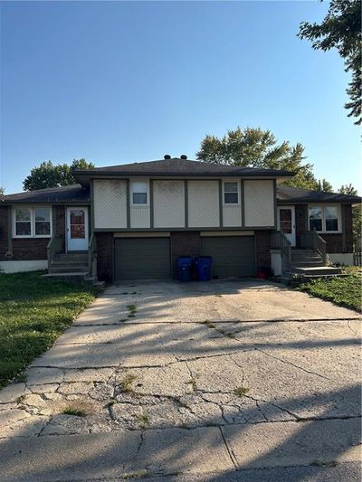 View of front of property with a garage | Image 1