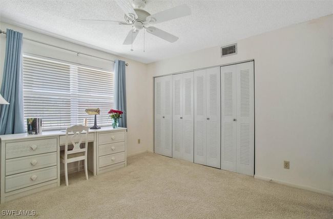 murphy bed, windows let in the light, desk, and ample closet space | Image 14