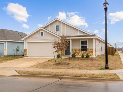 View of front of property featuring a garage and a porch | Image 2