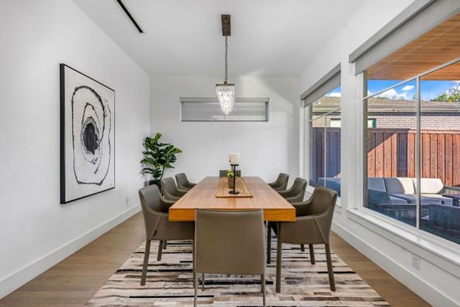 Dining space with light hardwood / wood-style flooring | Image 8