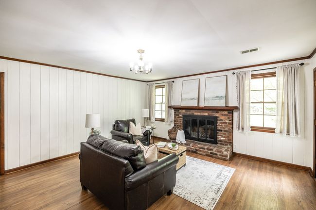 This living area is just off the kitchen and flows nicely for day to day living and entertaining as well. | Image 33