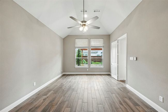 Empty room featuring lofted ceiling, tile floors, and ceiling fan | Image 17
