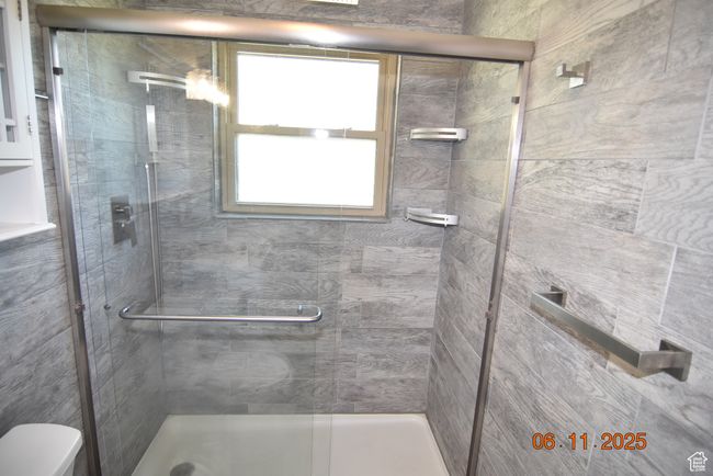Full bathroom with a stall shower and beautiful natural light | Image 37