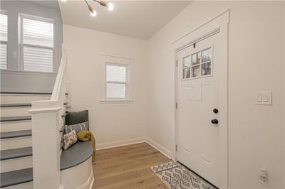 Entrance foyer featuring light luxury flooring and a wealth of natural light. | Image 3