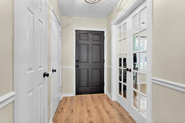 The office, with privacy French doors, is located just off the entry with views of the front yard. | Image 4
