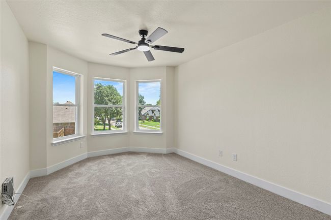 Spare room with carpet floors, a ceiling fan, and a textured ceiling | Image 26