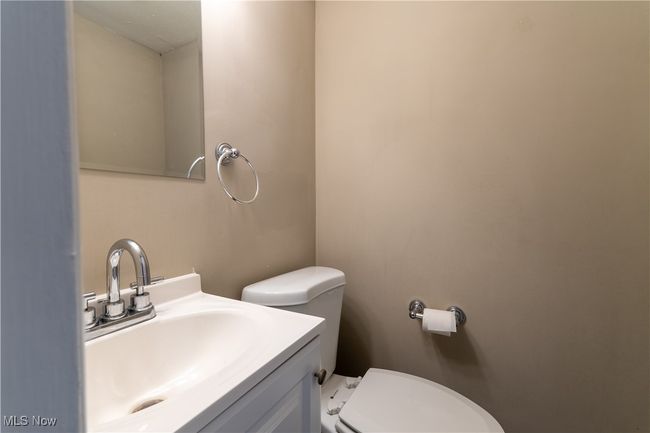 Half bath featuring vanity and toilet | Image 9