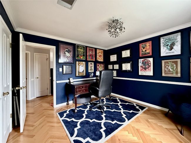 Home office with crown molding, baseboards, and visible vents | Image 26